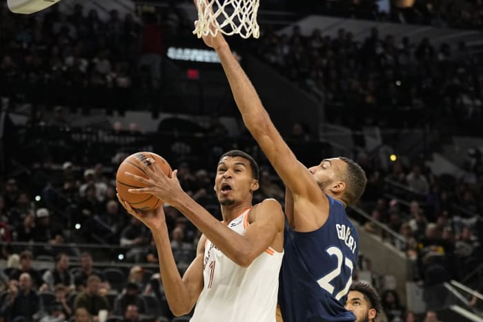 Nov 10, 2023; San Antonio, Texas, USA; San Antonio Spurs forward Victor Wembanyama (1) drives to the basket against Minnesota Timberwolves center Rudy Gobert (27) during the first half at Frost Bank Center.